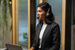 Asian indian woman call center - customer service. Attractive business Asian woman in suits and headsets working with desktop computer at telemarketing customer service agents