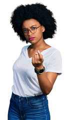 Poster - Young african american woman wearing casual white t shirt beckoning come here gesture with hand inviting welcoming happy and smiling