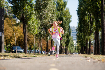 Poster - Photo portrait of ponytails cute small girl running shopping big sales dressed stylish garment elementary school student park