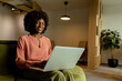 © BGStock72 - Radiant African American entrepreneur innovating at her modern workspace during a peaceful morning