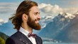 Groom with long hair and beard in wedding suit and bow tie, in front of wonderful view, Alps and mountain lake