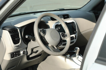 Wall Mural - Black steering wheel and dashboard in modern car