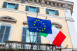 Italian and European union flags at building in Rome, Italy.
