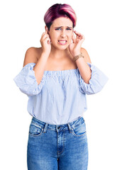 Canvas Print - Young beautiful woman with pink hair wearing casual clothes covering ears with fingers with annoyed expression for the noise of loud music. deaf concept.