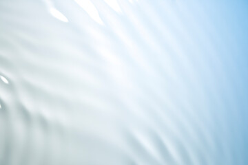 Wall Mural - the clear blue surface of the water gradients from light to dark.