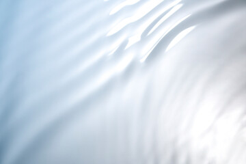 Wall Mural - the clear blue surface of the water gradients from light to dark.