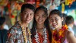 Trio of smiling young friends adorned with lei necklaces at a Songkran festival market