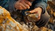 © AlfaSmart - Geologist examining a gold vein at a mining site, with a magnifying glass in hand