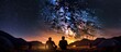 Back view of young couple tourists having a rest at campfire near glowing tent under night sky full of stars and Milky way.