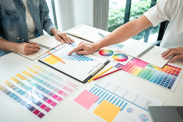 Poster - Team of creative graphic designer working on color swatch samples chart for selection coloring in inspiration to create new collection at workplace