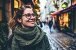 Portrait of a young woman in Paris, France wearing glasses and scarf