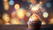 A birthday cupcake with sprinkles and sparklers and a background with decorations in bokeh 