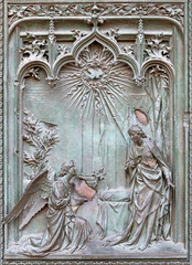 Sticker - MILAN, ITALY - SEPTEMBER 16, 2024: The detail from main bronze gate of the Cathedral - Annunciation -  by Ludovico Pogliaghi (1906).