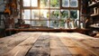 © mars58 - Empty wooden table in the foreground; blurred background with carpenter's tools on the wall