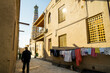 Khiva, Uzbekistan, Central Asia: a man strolls in the evening heat towards a minaret in the historic old town of Khiva (Itchan Kala), a UNESCO World Heritage site popular with tourists in Uzbekistan.