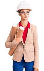 Poster - Young beautiful woman wearing architect hardhat and glasses holding blueprints thinking attitude and sober expression looking self confident