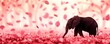 Elephant standing among falling pink petals
