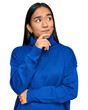 © Krakenimages.com - Young asian woman wearing casual winter sweater serious face thinking about question with hand on chin, thoughtful about confusing idea