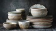 A collection of bowls and plates piled up. Perfect for kitchen and dining concepts