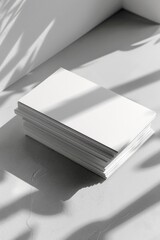 Poster - A stack of white paper on a table. Suitable for office or education concepts
