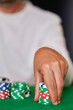 Closeup of hands betting chips in casino