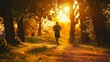 Man running down a sunlit path in an autumn forest. Endurance training and nature connection concept