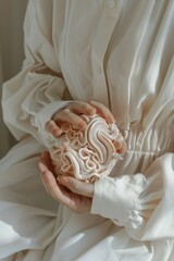 Poster - A woman in a white dress holding a brain model. Suitable for educational and medical concepts
