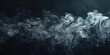 Close up view of smoke on a dark black background. Ideal for abstract design projects