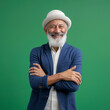 © mindstorm - lifestyle photo Happy, arms crossed and portrait of man on green screen for confident, fashion and elegant Muslim American.