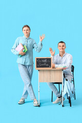 Poster - Students near chalkboard with text GOODBYE SCHOOL waving hand on blue background. End of school concept