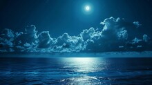 Moonlit Night Over The Serene Sea, Clouds Softly Illuminated By The Moon's Glow