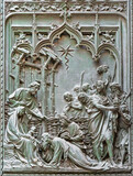 Fototapeta  - MILAN, ITALY - SEPTEMBER 16, 2024: The detail from main bronze gate of the Cathedral -   Three magi -  by Ludovico Pogliaghi (1906).