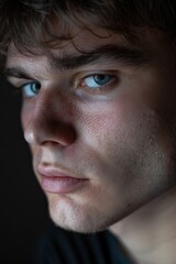 Poster - Close up of a young man with striking blue eyes. Ideal for various projects