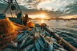 fishing boat full of fish nets at sunrise