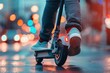 Person riding a scooter in city, closeup, cropped image. Legs on electric scooter