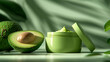 A mockup of a cosmetic product on a green background among avocados and green leaves. The concept of natural skin care and beauty.