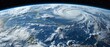 Planet Earth shows swirling hurricane spiral clouds from space