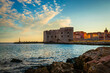 Sunset panoramic view on walls and port of famous old city Dubrovnik, Croatia