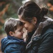 Boy kissing forehead of mother in park. Generative AI