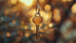Shiny key hangs from lock with blurred white backdrop