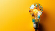A light bulb against a yellow background, filled with electronic circuits and components, symbolizing innovation, technology, and bright ideas.