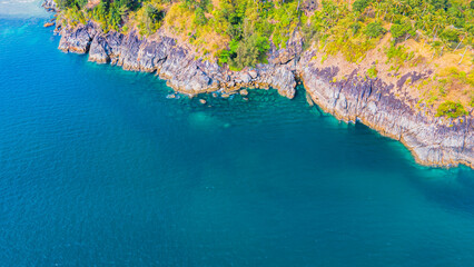 Wall Mural - Paradise beach Phuket Patong. aerial top view amazing freedom beach small white sand beach with perfect nature. white wave hit the rock around island. green forest peaceful. green sea, landscape.