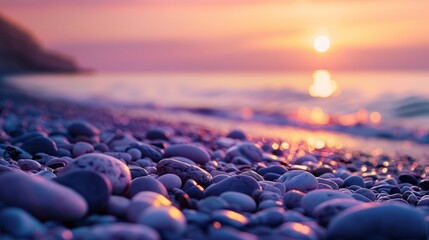 Canvas Print - The sun is setting over the ocean, casting a warm glow on the rocks in the foreground