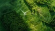Majestic aerial view of rolling green hills with wind turbines during a misty sunrise.