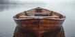 Old wooden rowboat on a calm lake, morning mist, close-up on the oars and water droplets, tranquil 