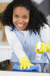 a happy professional cleaner cleaning