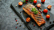 Grilled salmon steak on a stone plate