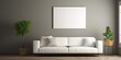 interior design with a white couch as the main furniture piece, a picture frame on the grey wall