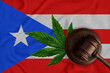 Cannabis and judges gavel on the Puerto Rican flag background. legalization concept