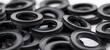 Precision engineering concept. A close-up of numerous high-quality rubber gaskets, an essential component in automotive and machinery for creating tight seals